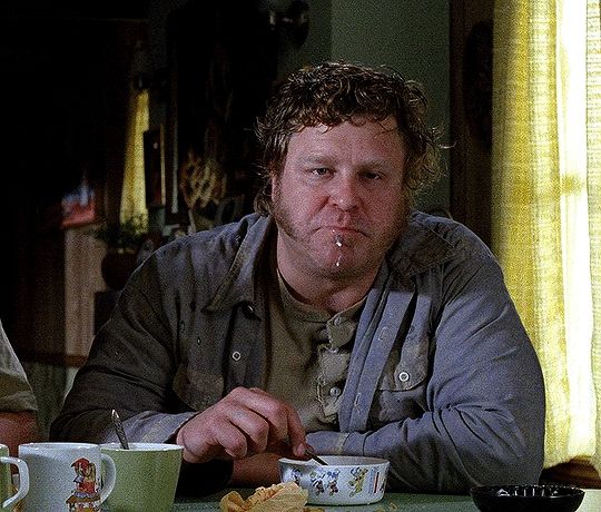 Messy looking man eating cereal at a table 
John Goodman in Raising Arizona 