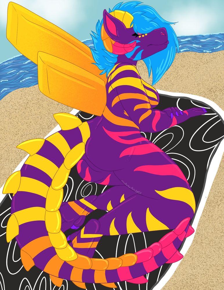 Valkyrja sunbathing on a towel that has yellow swirls