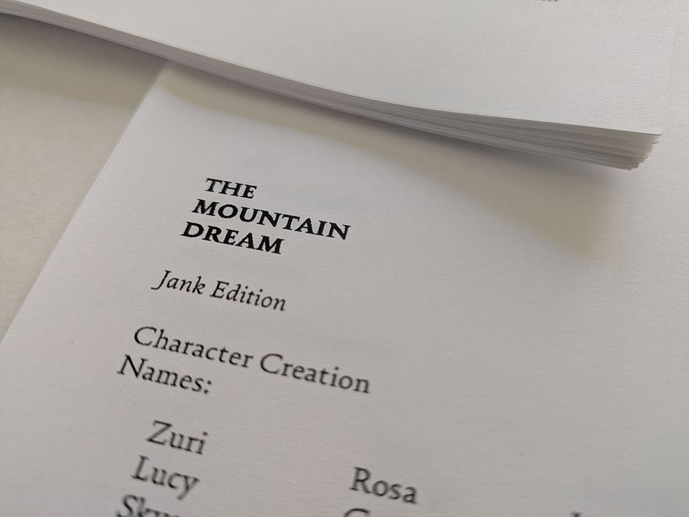 Portion of a printout in a basic unstyled font reading "The Mountain Dream, Jank Edition," and the start of a character creation section.
