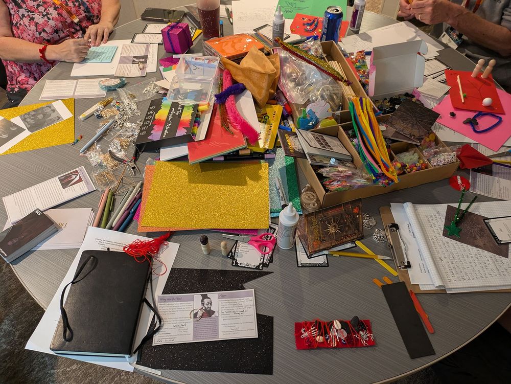 An entire table filled with sundry arts and crafts supplies