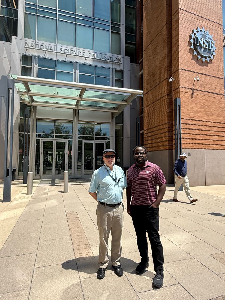 Professors Robert Gilliard and John Protasiewicz standing in front of NSF headquarters building. 