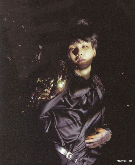 WINGS era - Yoongi in black on a black background with that lovely sparkly jacket and oh the look on his face is downright sensual - yes? 