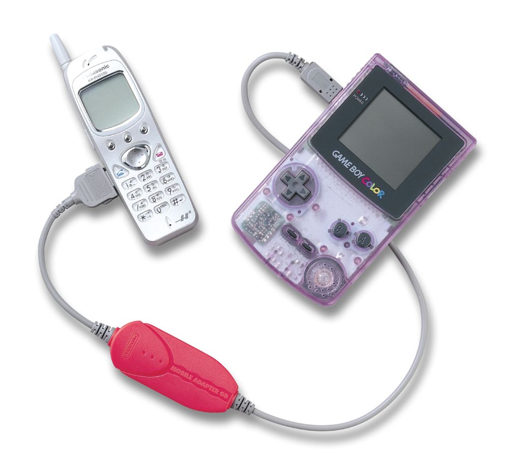 An overhead shot of a translucent purple GBC connected to a silver mobile phone.