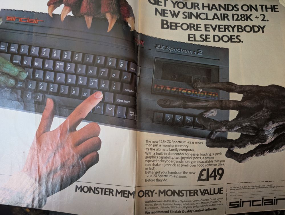 A double page ad for the then-new Spectrum +2 with a variety of human and monstrous hands reaching for it. 