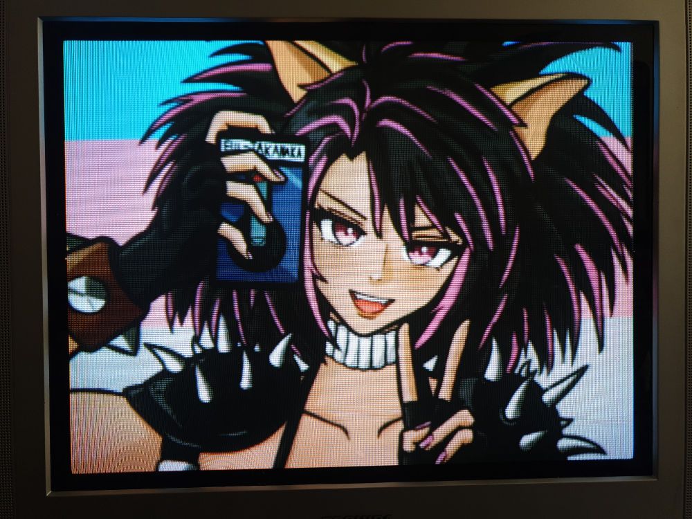 A crt TV photo of commissioned artwork of my goth-punky 80s catgirl sona/mascot delivering a v sign and holding up a rectangular cyberpunky floppy disk 