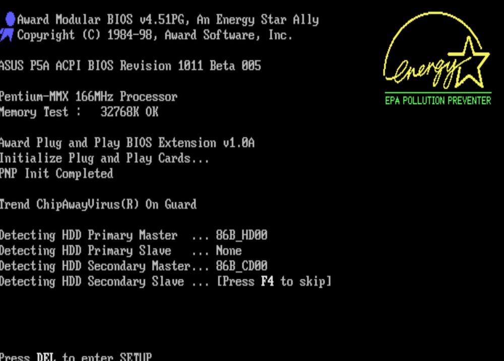 A snap from a late 90s desktop PC bootup for a Pentium MMX 166mhz with 32MB of RAM. A familiar Energy Star EPA Pollution Preventer logo can be seen on the top right, all yellow and green and glowy. 
