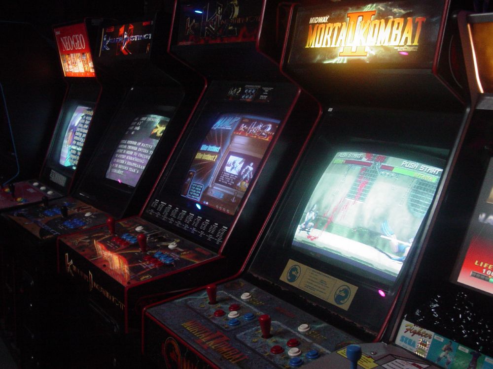 More cabs, this time in a row with Mortal Kombat II's illuminated marquee glowing away