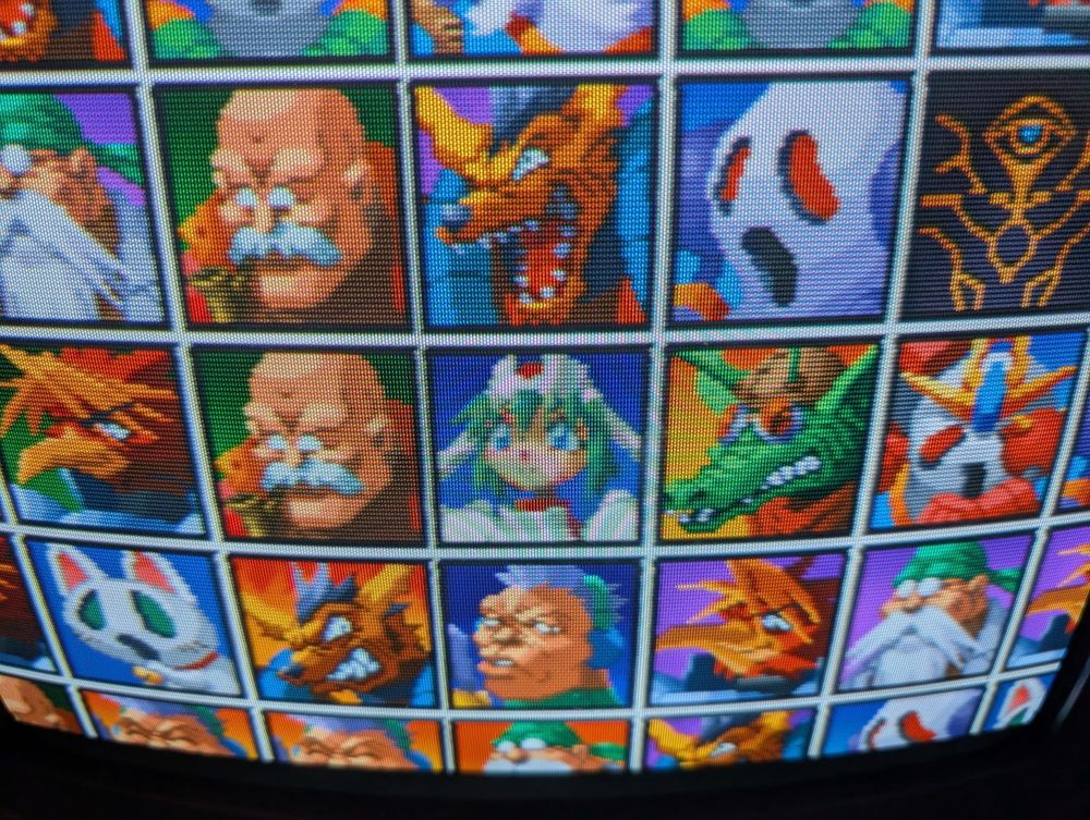 A crt tv screenie of Mischief Makers' character tile artwork intermission screens, with tiled headshot artwork of protags and antags alike