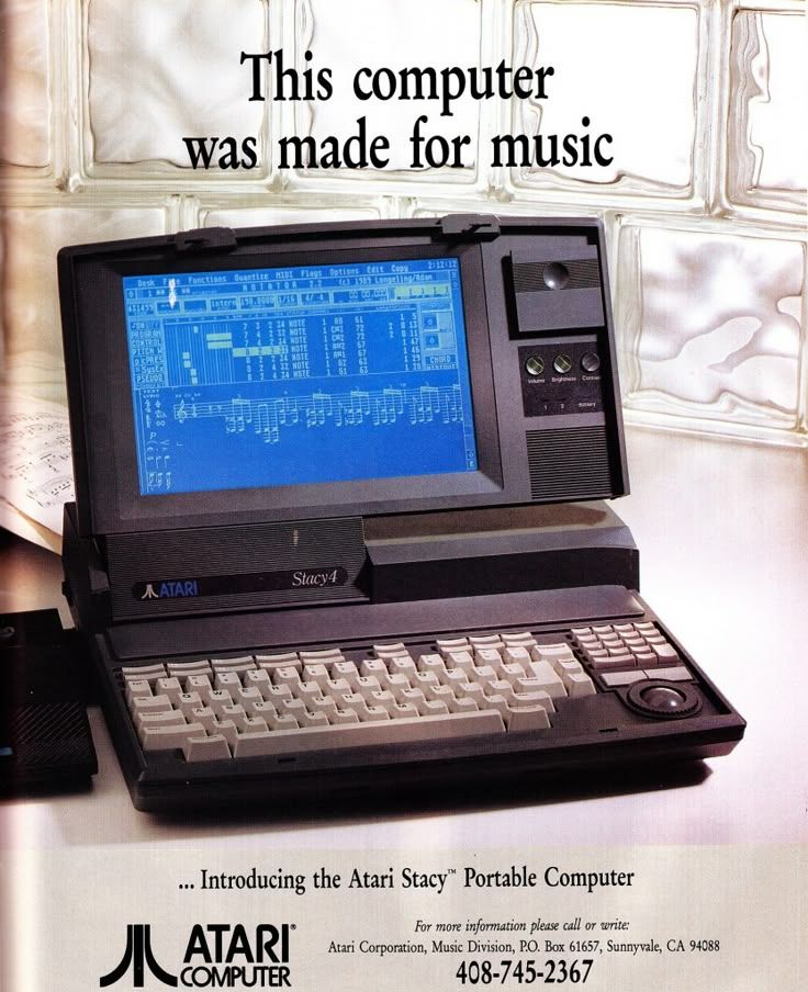 An ad for the Stacy with a photo of the portable computer (it's a bit bulky to call a true laptop) with a blue screen and charcoal grey casing and white keys. 