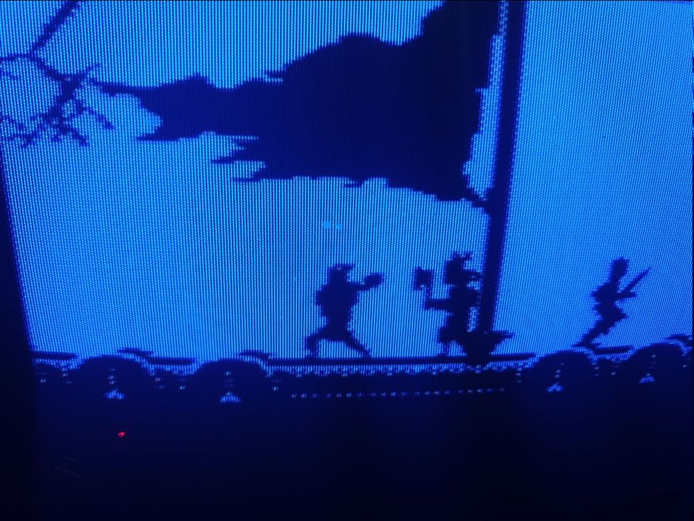 A snap (which took about five minutes of hitting the pause key to hit the right time and snap!) of a cool silhouette of the protag on a norse longship, its tattered sail flapping in the wind as lightning crackles and axe-wielding warriors engage. 