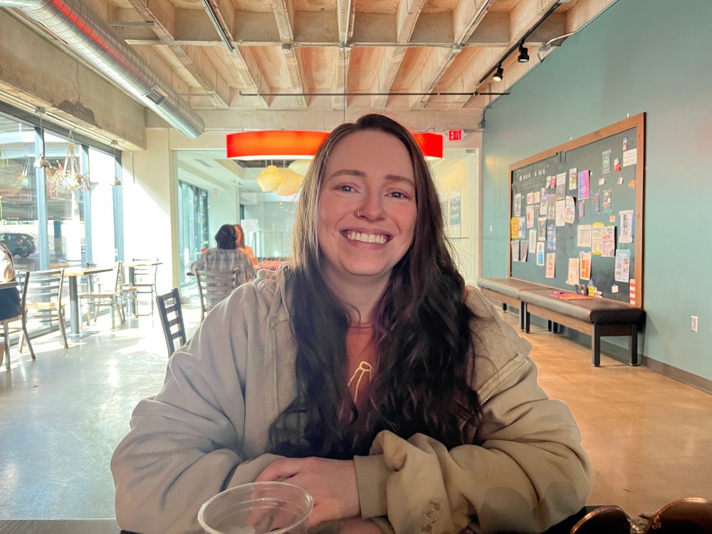 my wife, Kayla, sitting in a sunny coffee shop, across the table from me