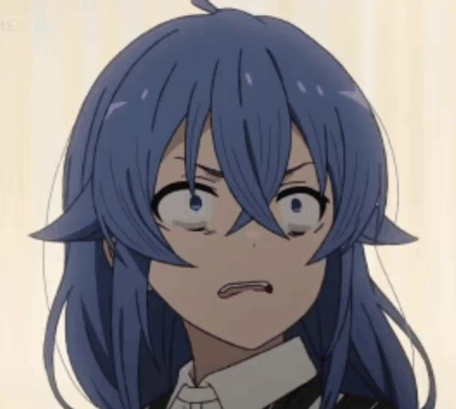 a close up of a anime girl with blue hair making a funny face .