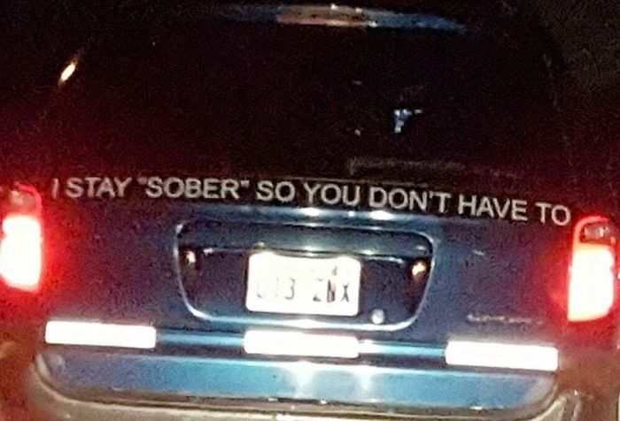 a sticker on the back of a person's car that says I stay "sober" so you don't have to