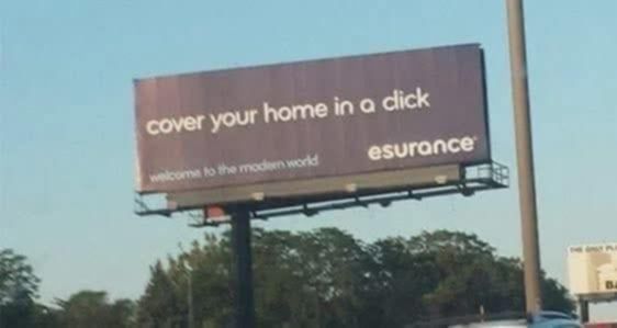 A billboard that says "cover your home in a dick ... esurance" - It's supposed to say "click" but the font letters are too close together