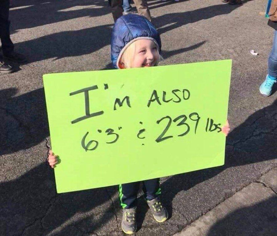 little girl with protest sign 