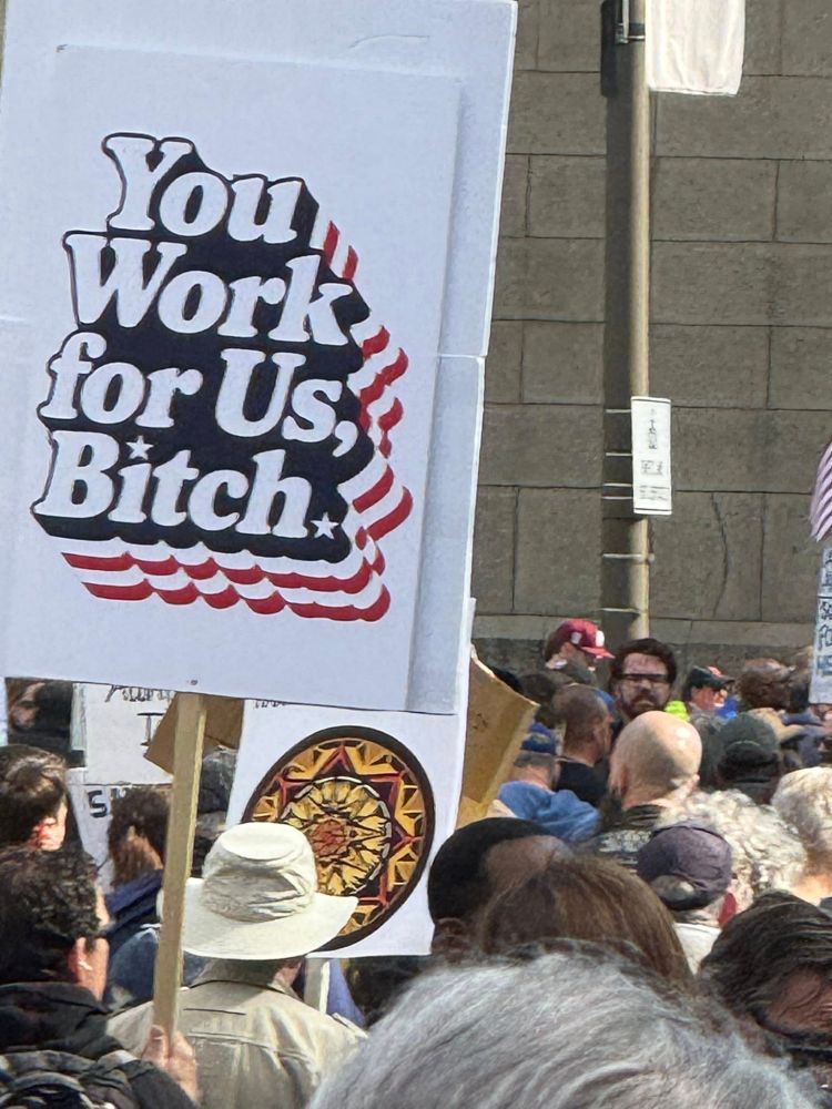 a protest sign that says you work for us, bitch