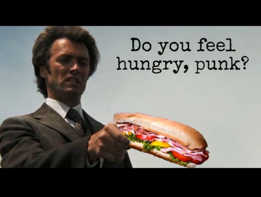 Clint Eastwood saying 'do you feel hungry, punk?' as he holds a hoagie