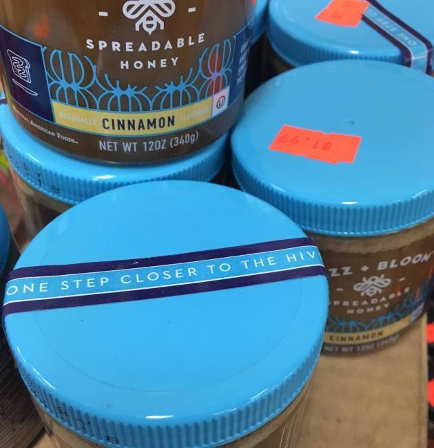 pic of spreadable honey brand cinnamon jar and the sticker on top says 'one step closer to hiv' - probably says 'hive' but got cut off