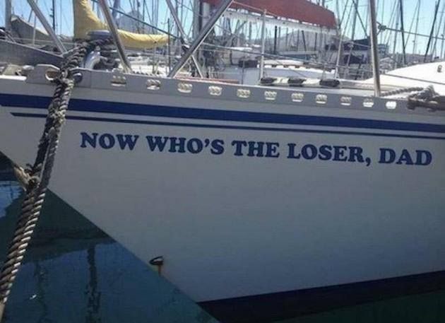 a yacht that says no who's the loser, dad (or it could be a large boat)