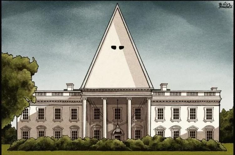 Artist: Ben Jennings

it's a pic of the white house with a big triangle roof with eyes so it looks like a KKK hood