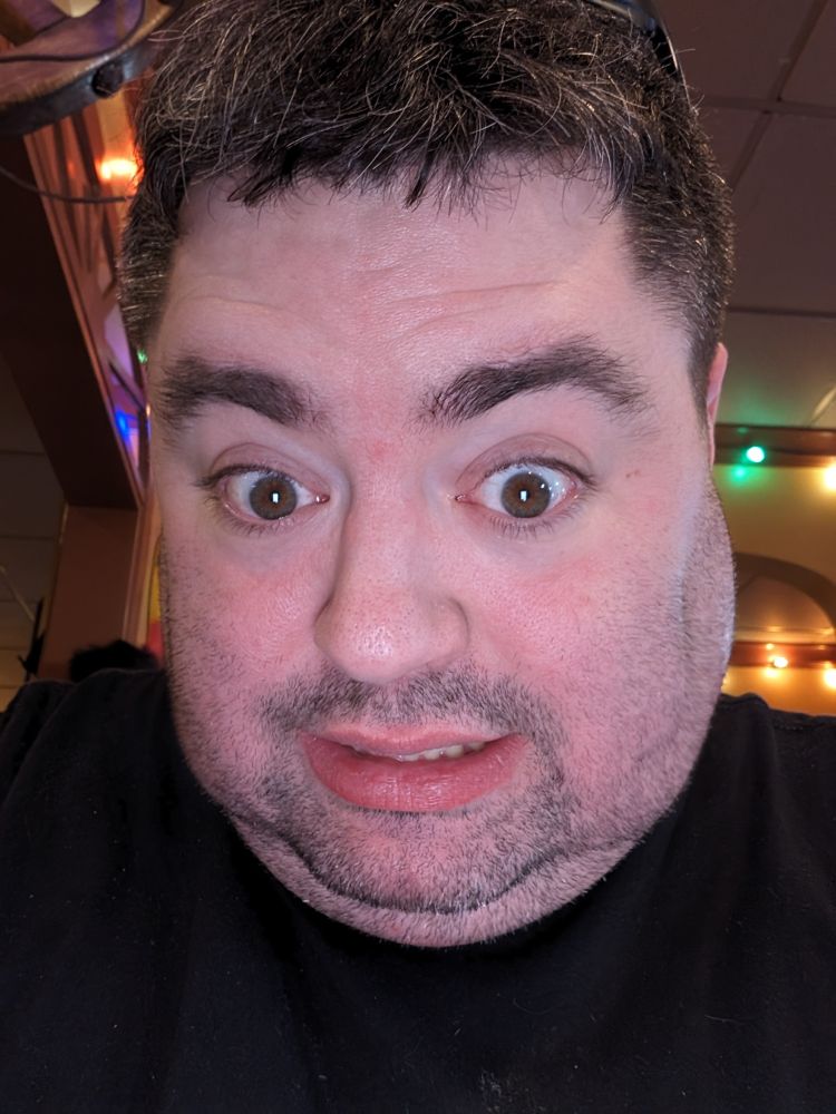 Natalie in April 2024 looking like a drunken scruffy dork