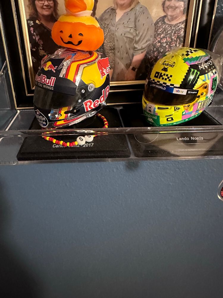 Carlos Sainz 2017 Toro Rosso helmet with a pumpkin rubber ducky on top