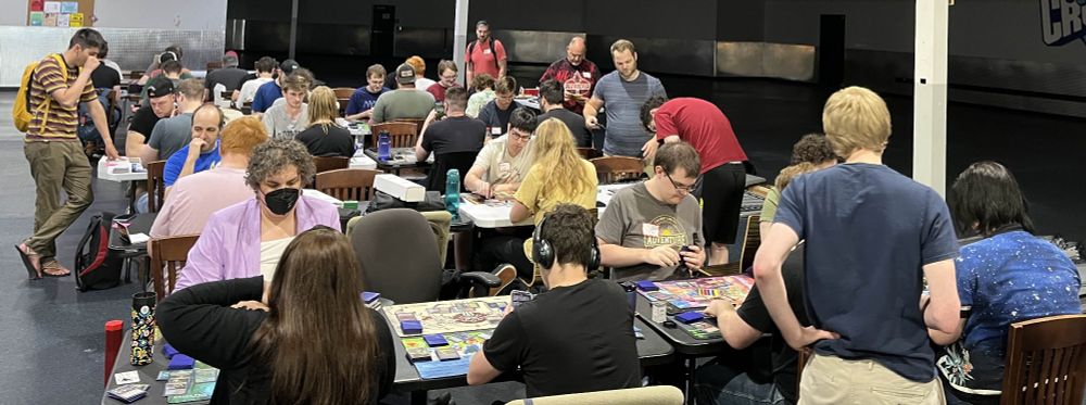 A room full of people playing Magic: the Gathering