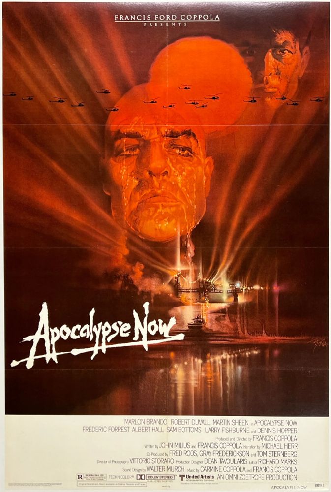 Movie poster for Francis Ford Coppola's "Apocalypse Now" (1979). Martin Sheen and Marlon Brando's faces loom ominously alongside a blood-red sun, over a Vietnam-war river battle. 