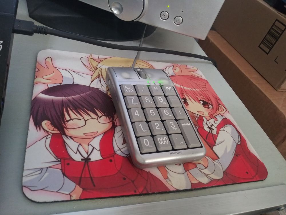 Numpad mouse on a Hidamari Sketch mousepad.