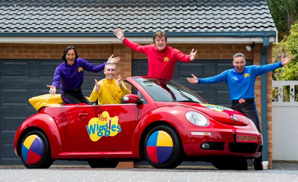 A picture of the wiggles in a real life new beetle Volkswagen based toot Chugga Chugga big red car