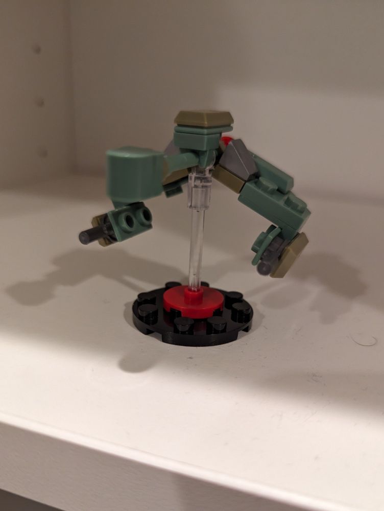 tiny off-brand lego model of a klingon bird-of-prey, another angle but blurrier this time