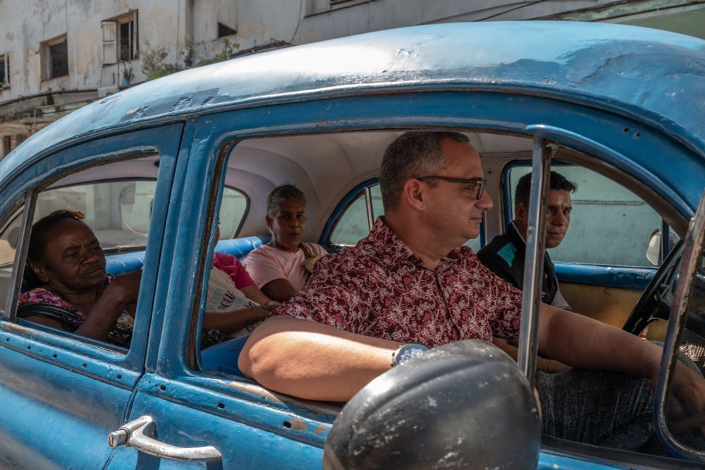 Passengers in a collectivo taxi in Havana, Cuba