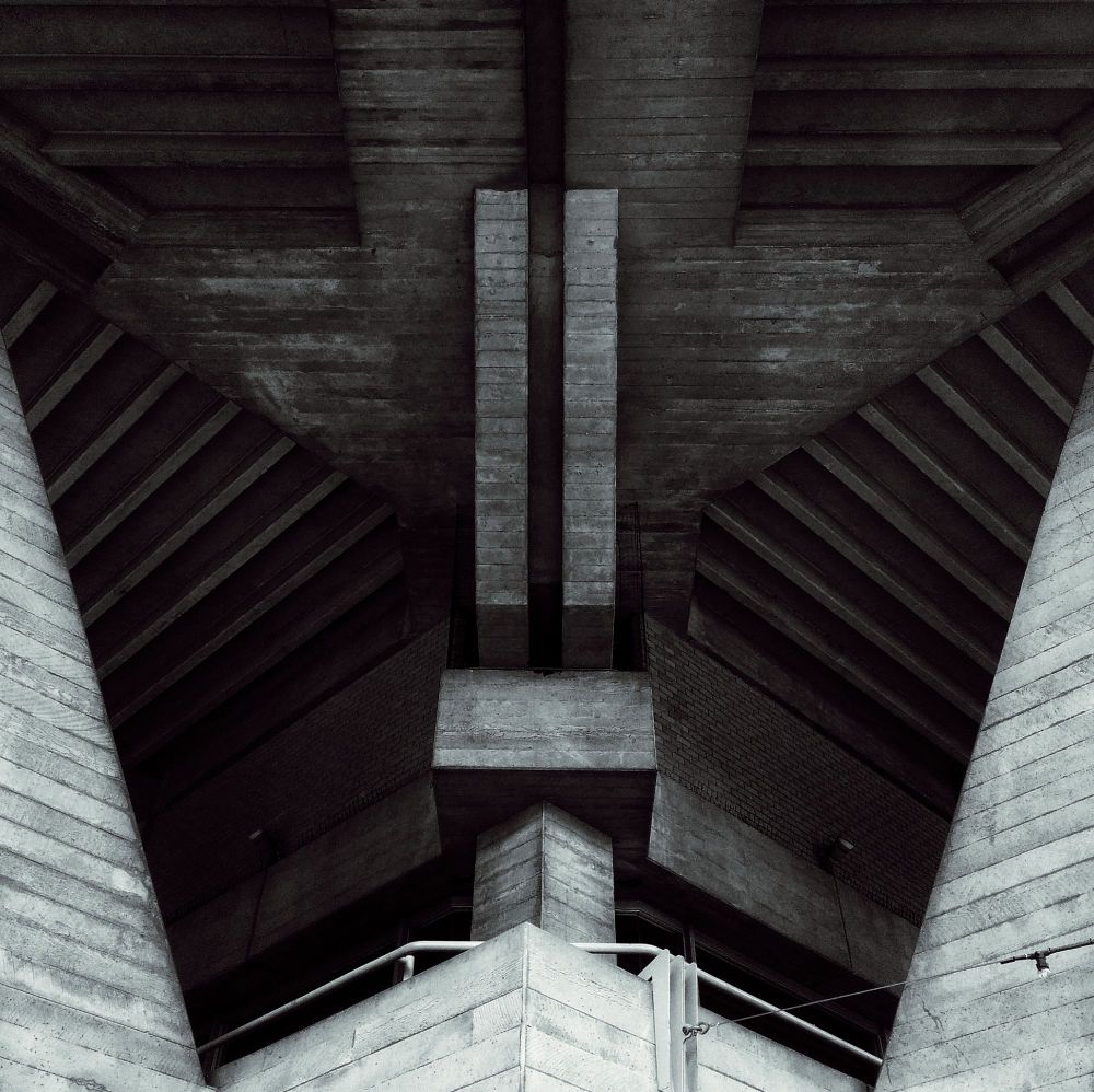 Black and white abstract photo of up-close brutalist architecture.