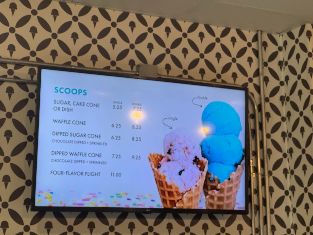A menu with two ice cream cones. The first has two scoops and is labeled "single". The second has three and is labeled "double".