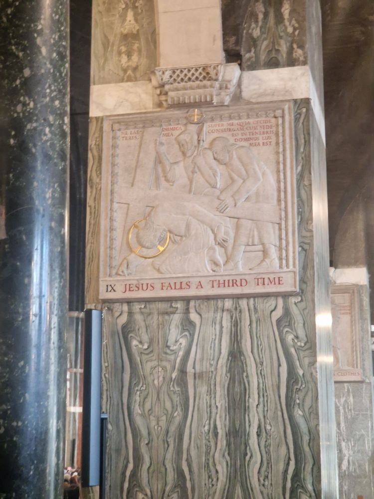 Inscription under a carving saying Jesus falls a third time.