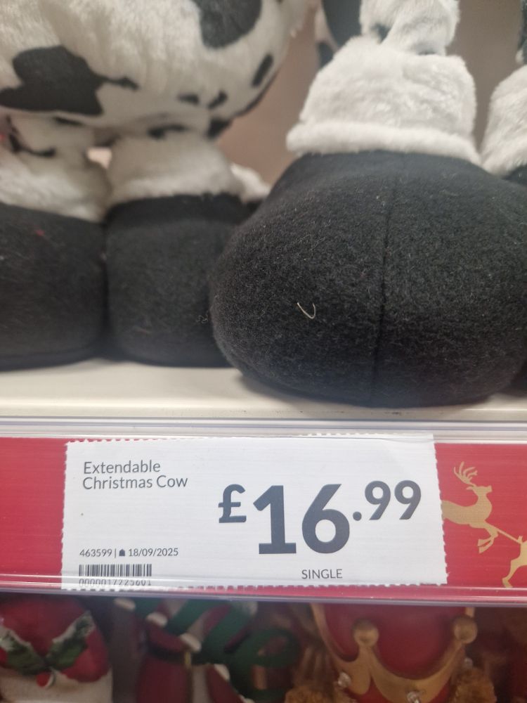 Ticket saying extendable Christmas cow. 