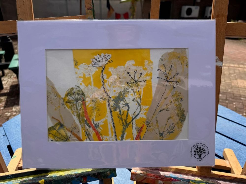 Mounted mixed media picture of yellow flowers. 
