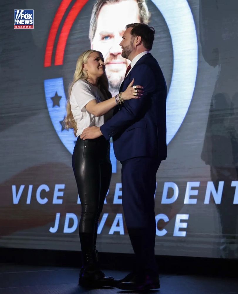 JD Vance with Charlie Kirks wife who is dressed like she's back on the market