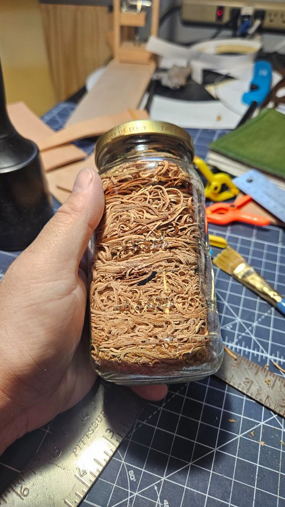 A glass jar full of thin strips of leather from pieces I have edge beveled.
I refer to it as "steampunk spagehtti"