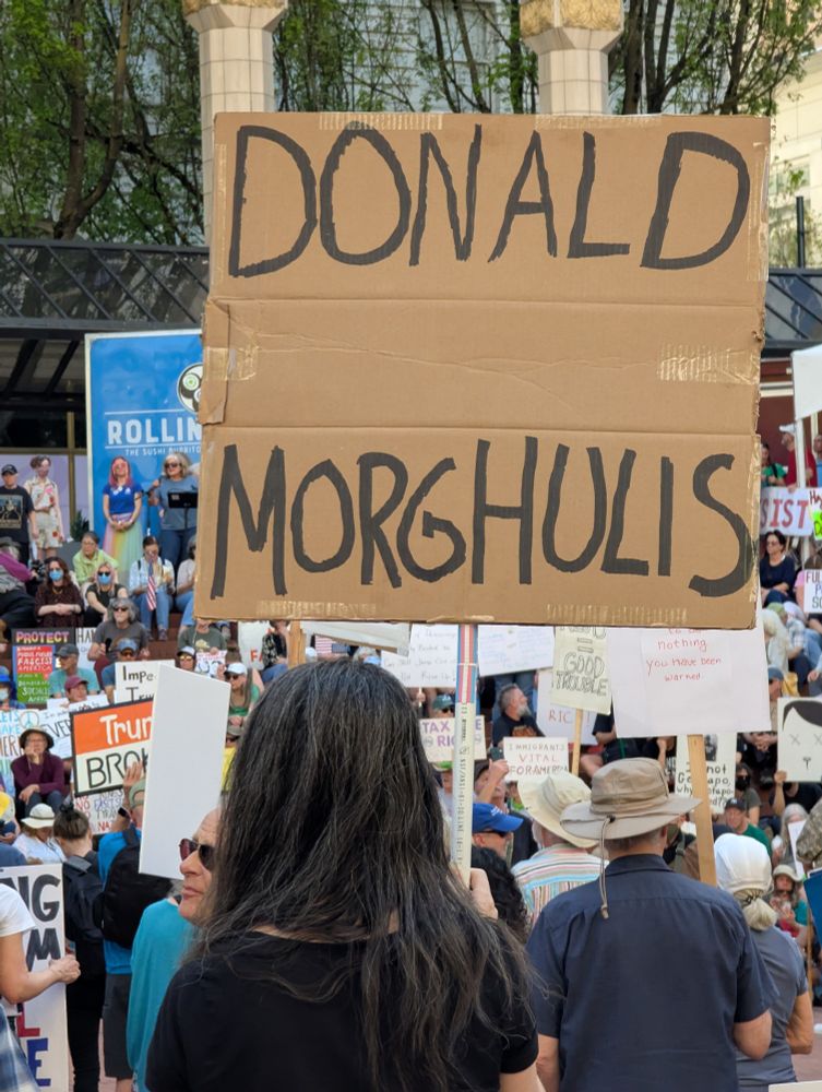 Protester holding sign reading "Donald Morghulis"