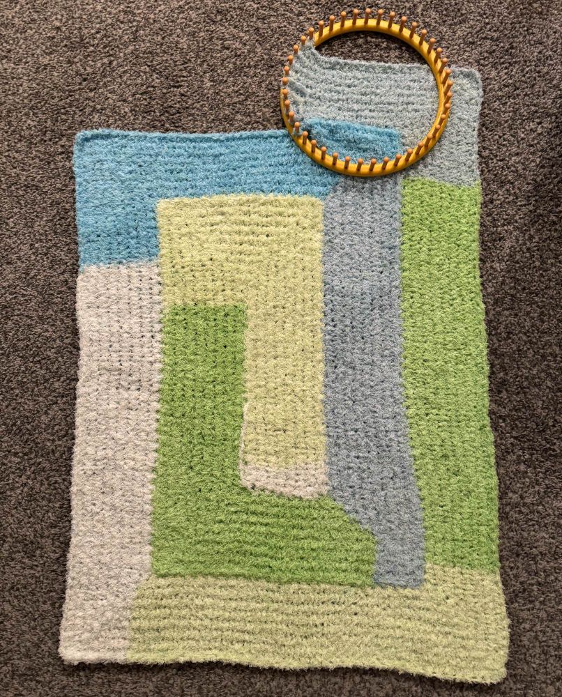 Image of a WIP (work in progress) blanket that I’ve now finished the first skein of work on.