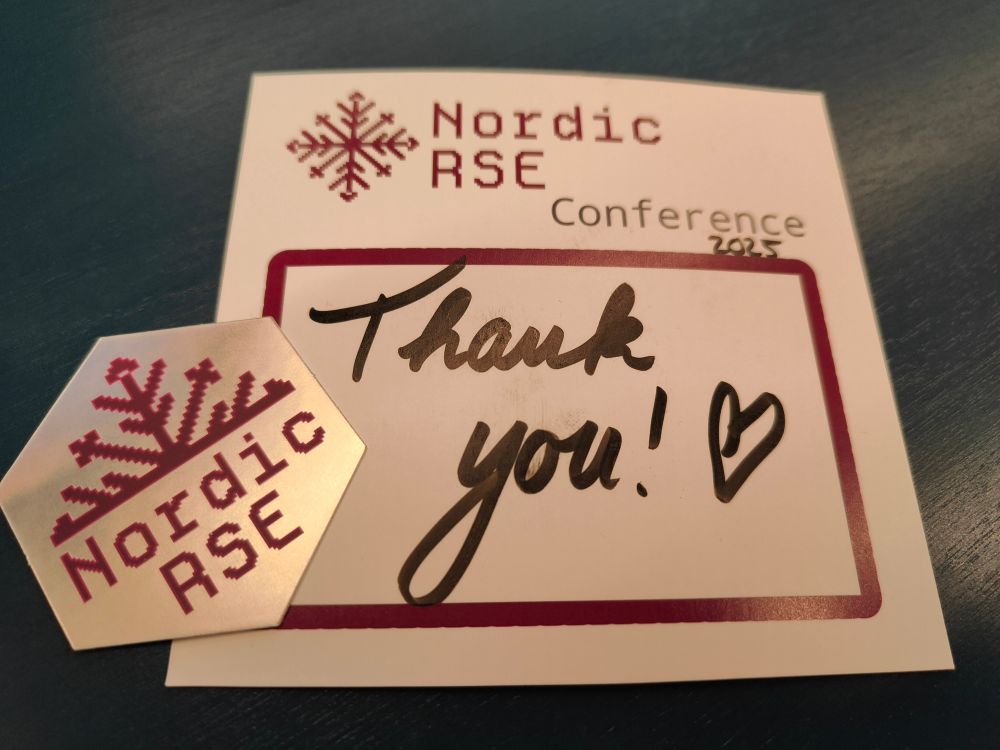 
photo of a card saying Nordic-RSE conference 2025 - thank you! with a heart. and a hexagon sticker with half a snowflake and Nordic-RSE written underneath. 