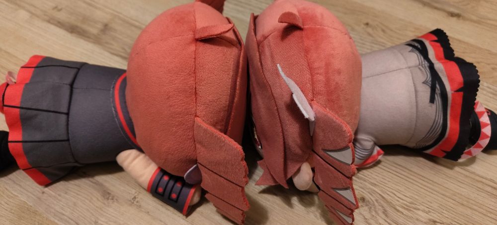 Teto plushies lying in front of each other
