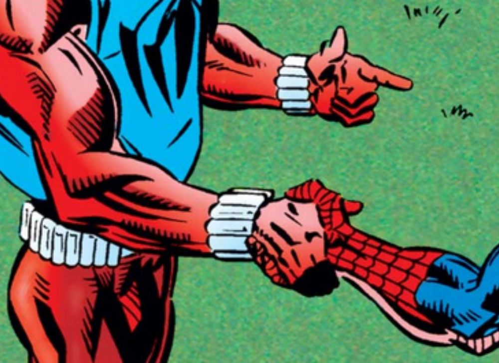 Scarlet Spider and Spider-Man shake hands. Ben uses his other hand to do finger guns.

Panel from Amazing Spider-Man #400