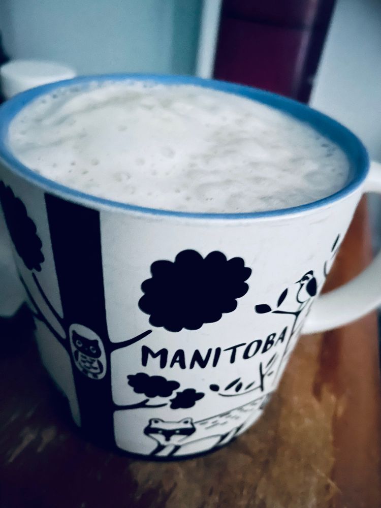 Cup of coffee with foamy milk