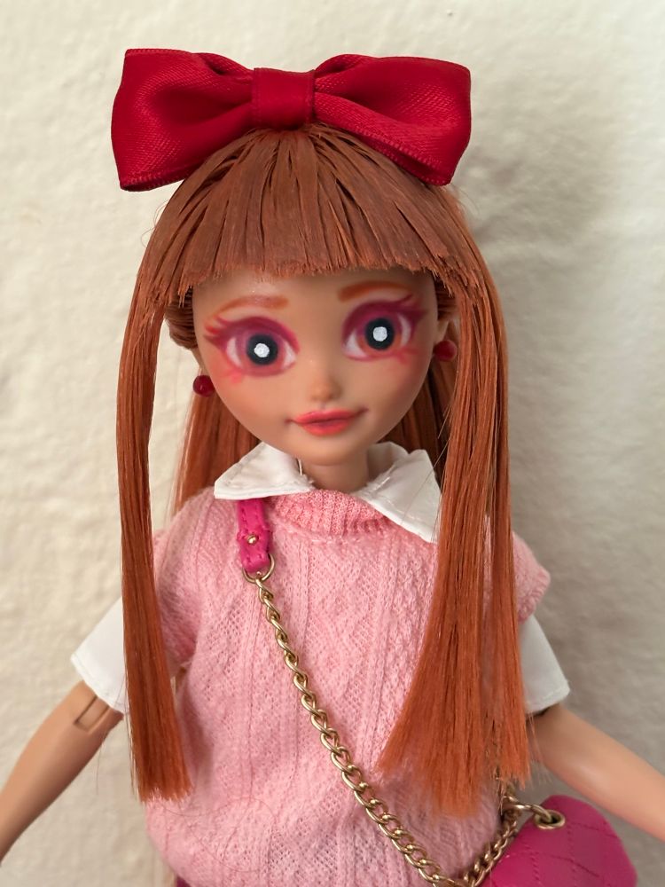 A closeup of the Blossom custom doll.