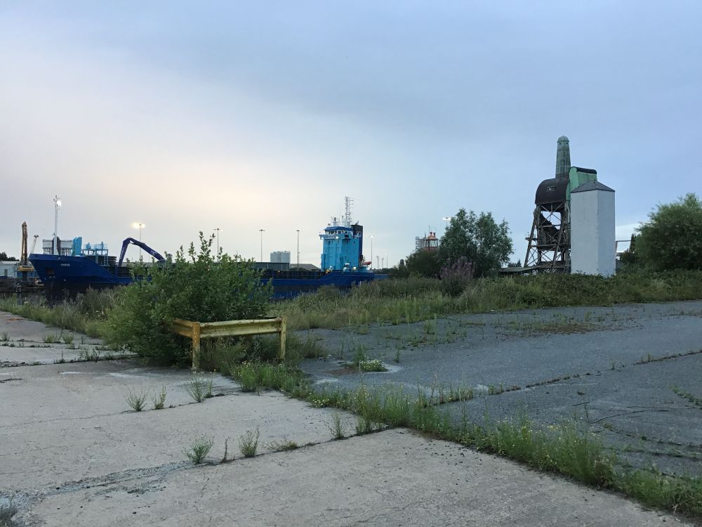 The tarmac edge of Goole Model Boat Club: a purpose-built sailing pond in the town's historic south dock, with a listed boat hoist in its grounds.