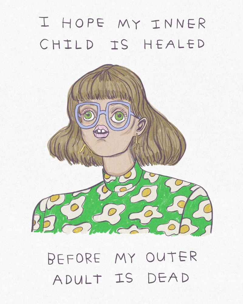 An illustration of a woman with short hair and bangs, wearing purple glasses and a green turtleneck with an egg pattern on it. The text on the illustration reads: I hope my inner child heals… before my outer adult is dead