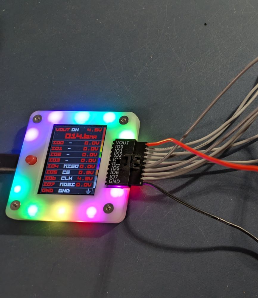 A Bus Pirate 6 powered up and connected to a target device. 