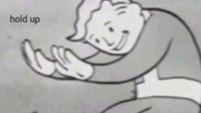 Black and white image of the Vault Boy, mascot from the Fallout series, with his hands outstretched, smiling. Caption at the top left says, "hold up". 
